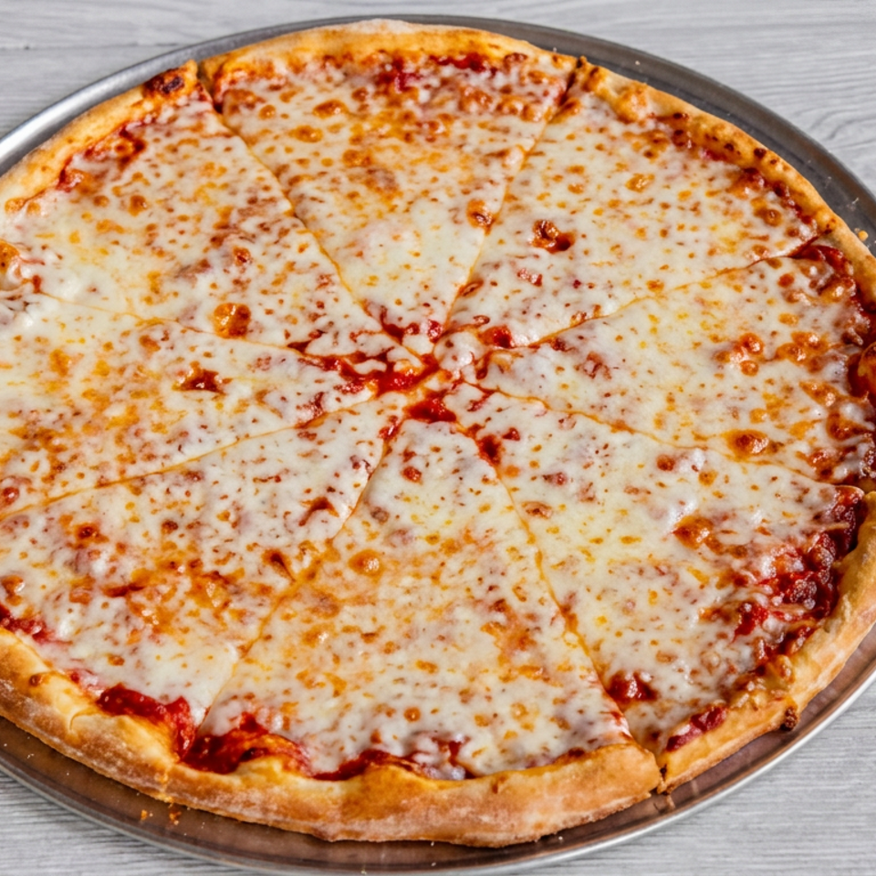 A whole cheese pizza, cut into slices, on a metal pizza pan.